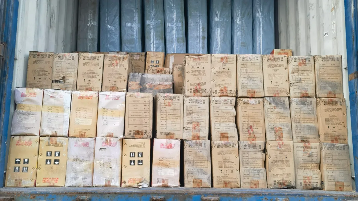 Cartons and panels loaded in a container on a truck