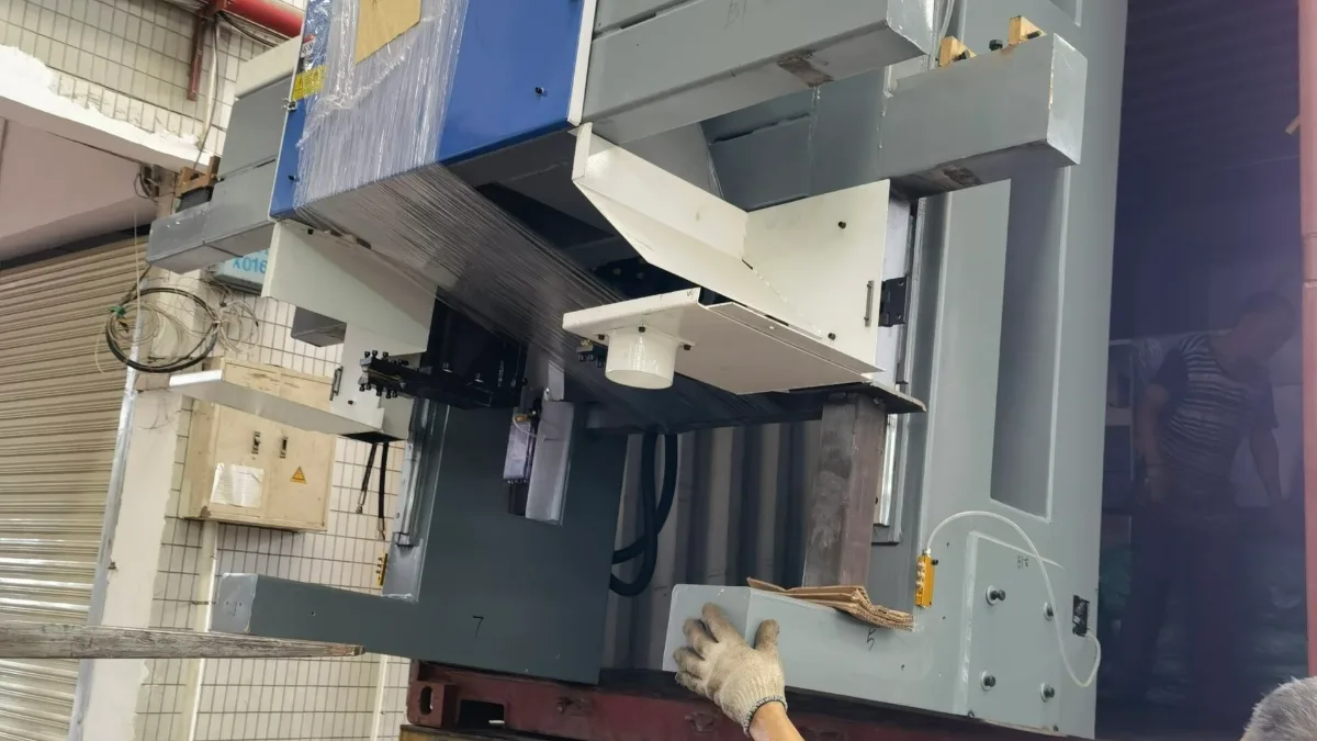 Industrial machine being loaded onto a truck for export