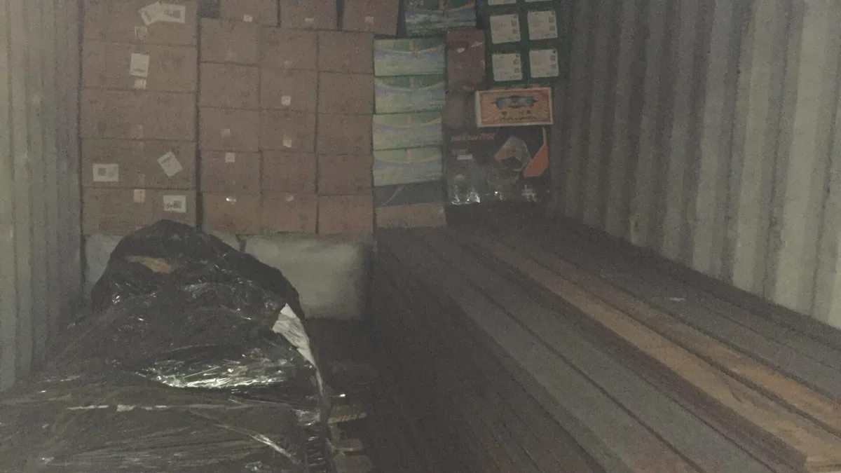 Mixed consolidated container load with cartons, steel channels and a wrapped pallet