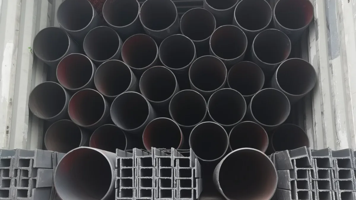 Steel pipes and H-beams loaded in a 40ft container